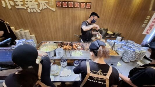 Xiaowang Zhugua - the cashier area beside the stove